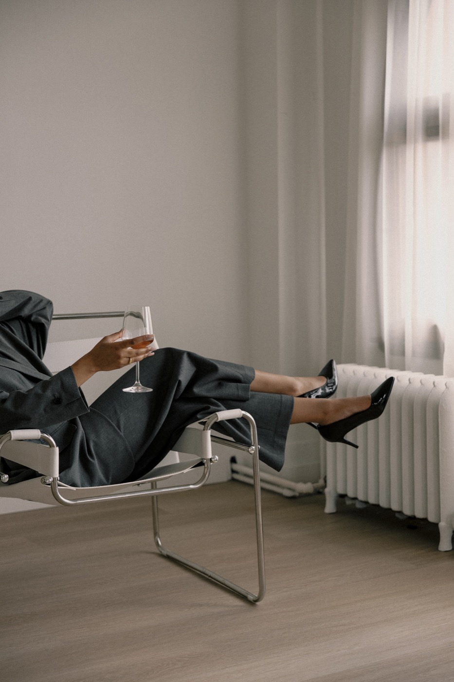 A woman relaxing in a chair, feet up