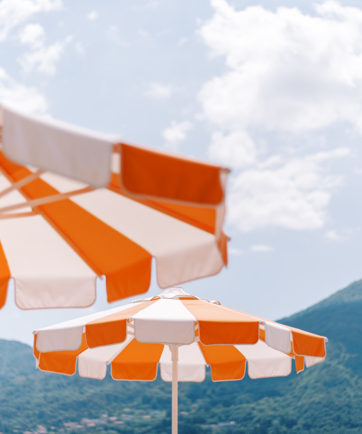 Striped parasols against a blue sky