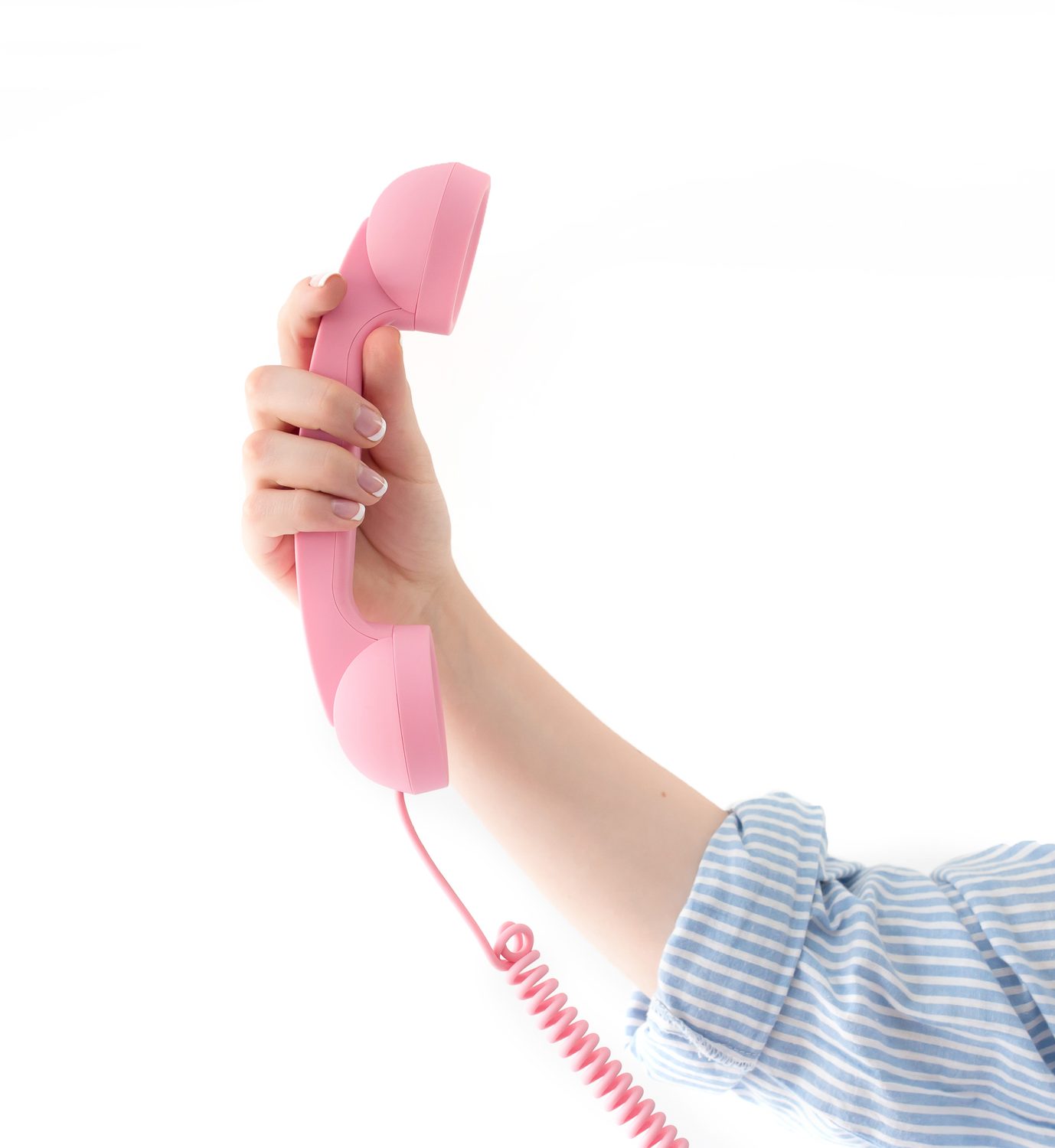 A hand holding up a pink telephone handset